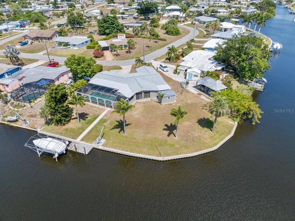 Be the envy of the neighborhood with a 160 Ft waterfront Tip Lot and newer sea wall