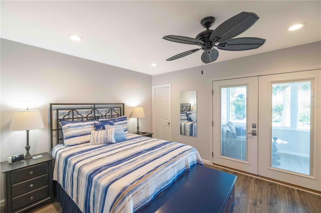 Master bedroom with double doors leading to all weather sunporch.