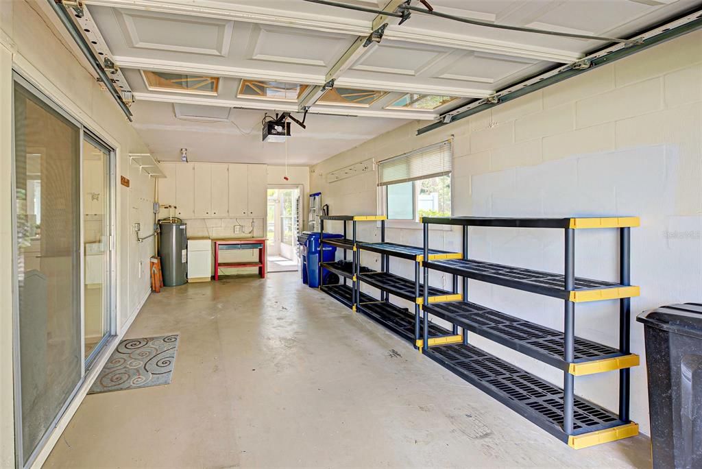 Extra long one car garage with automatic door opener and shelving