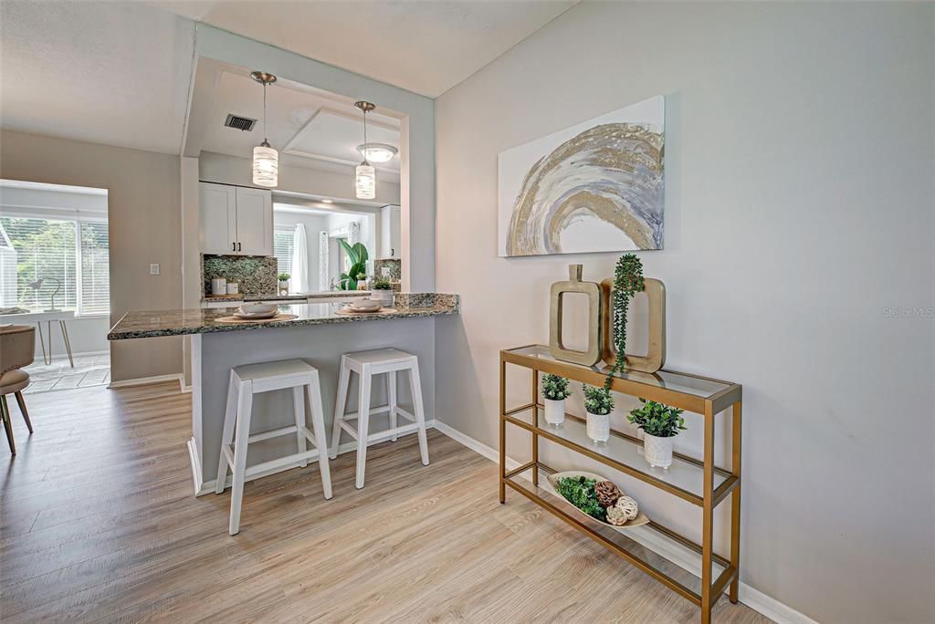 Looking from living room into kitchen and sunroom