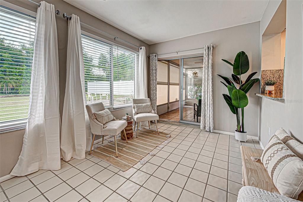 Entrance to lanai from sliding doors in sunroom