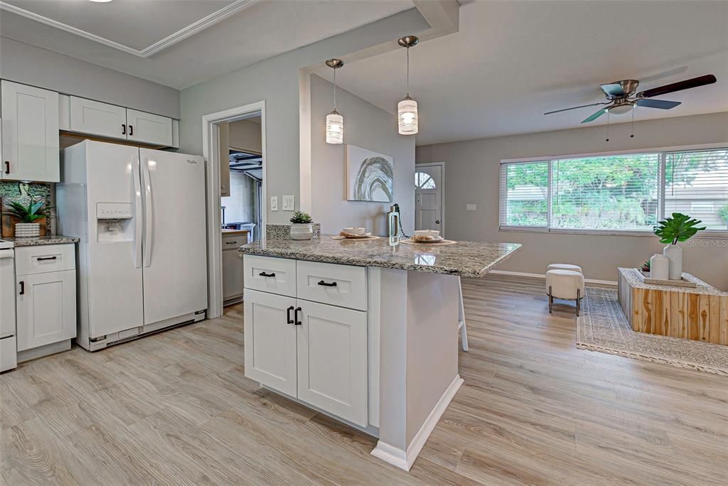 Another view of kitchen with door to laundry room