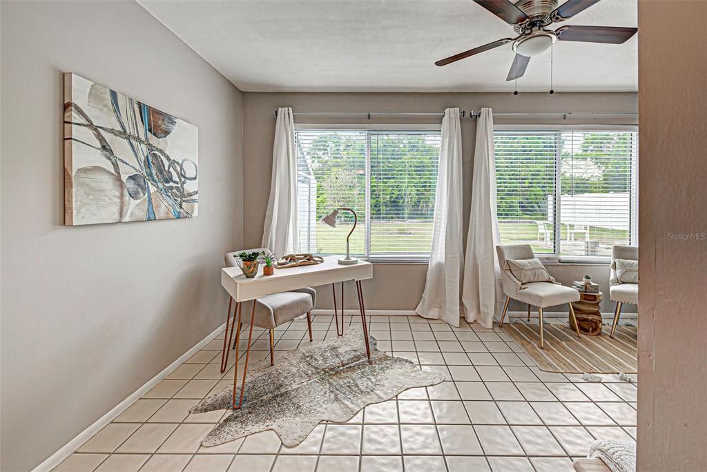 Sunroom is bright and sunny...overlooks large, private backyard.