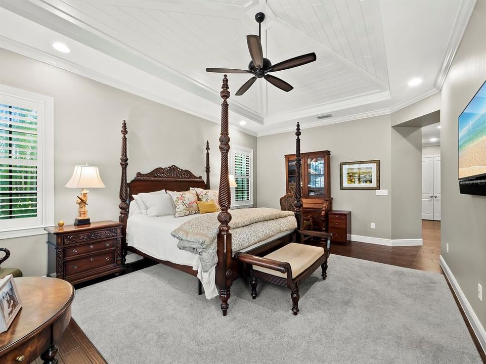 primary bedroom with wood vaulted ceiling