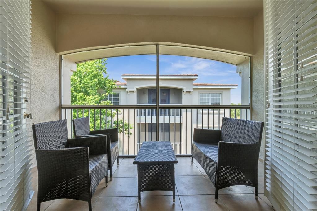 French doors open to the Screened Porch