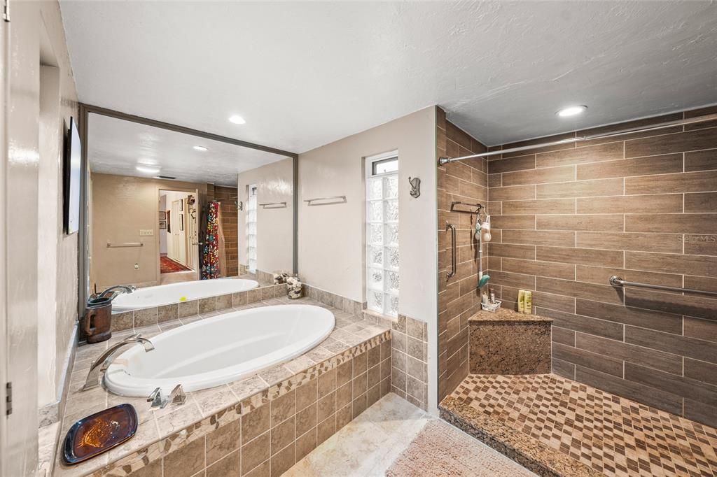 Stunning Primary Bath features NEW walk-in shower; garden tub & dual sinks (shown in another photo).