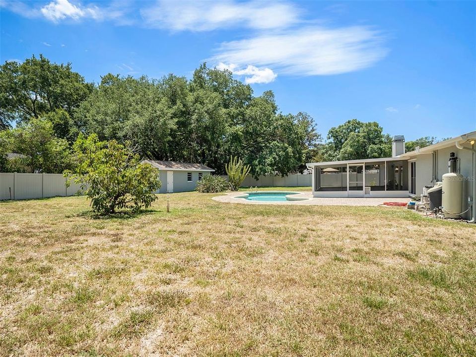 Block outbuilding on a slab foundation - endless possibilities! Fenced backyard. Pool.