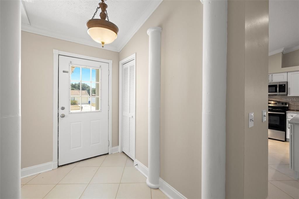 Coat closet at the entry with kitchen and great room just around the corner from the front door.