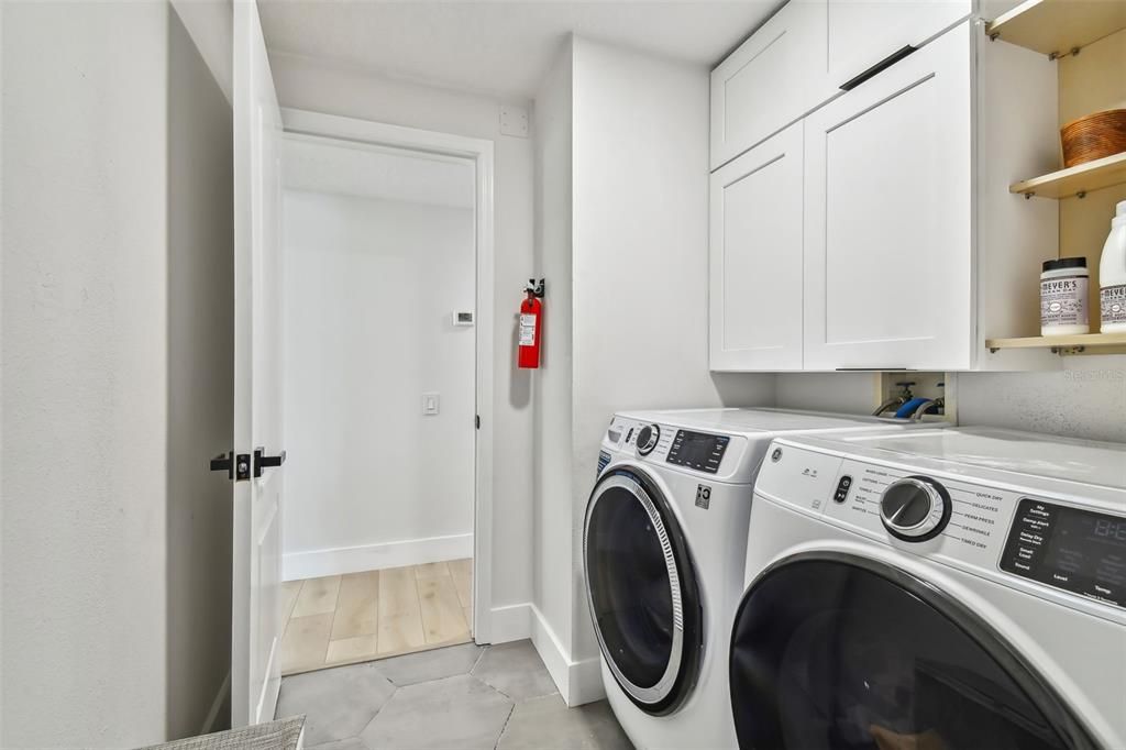 laundry with cabinets