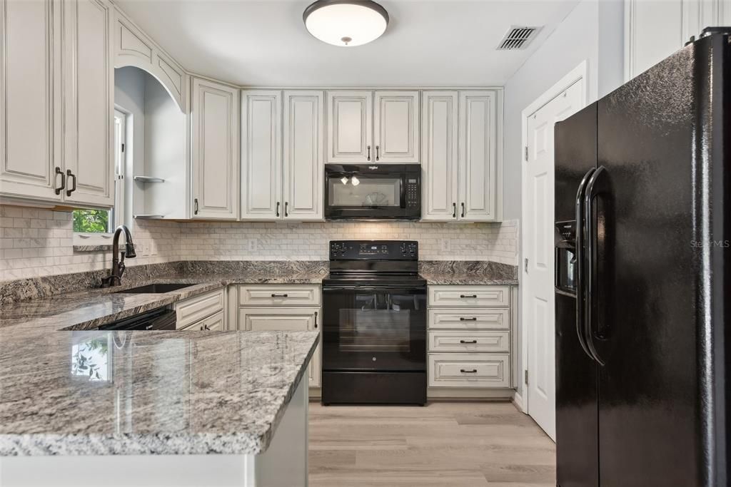 The KITCHEN RENOVATION itself has all NEW CUSTOM and HIGH-END CABINETRY, UPGRADED GRANITE COUNTERTOPS, EXTENDED COUNTER SPACE, NEW FLOORING and NEW APPLIANCES.