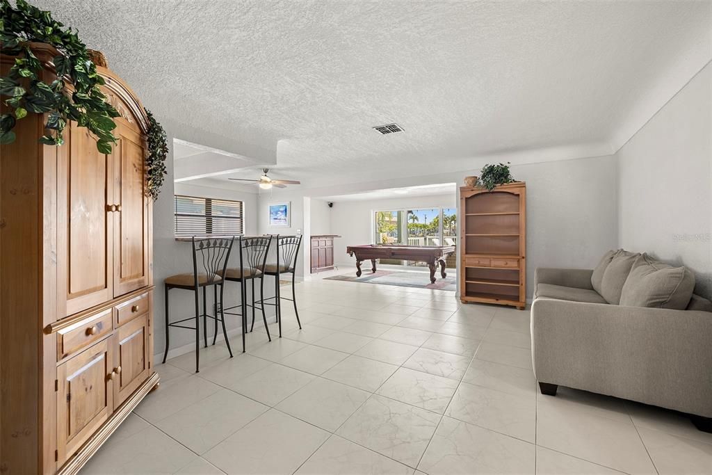 Family / Dining Room area looking out to the pool and water