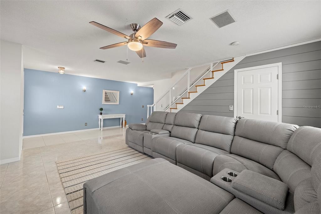 Living room with stairs to master bedroom