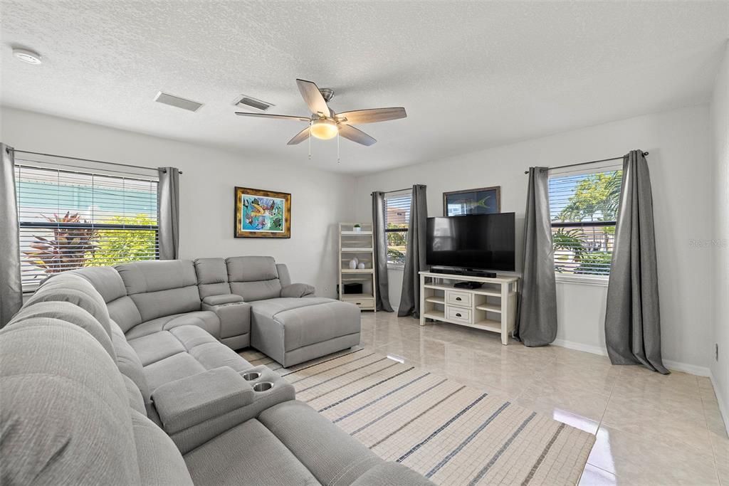 Large living room with storage under stairs