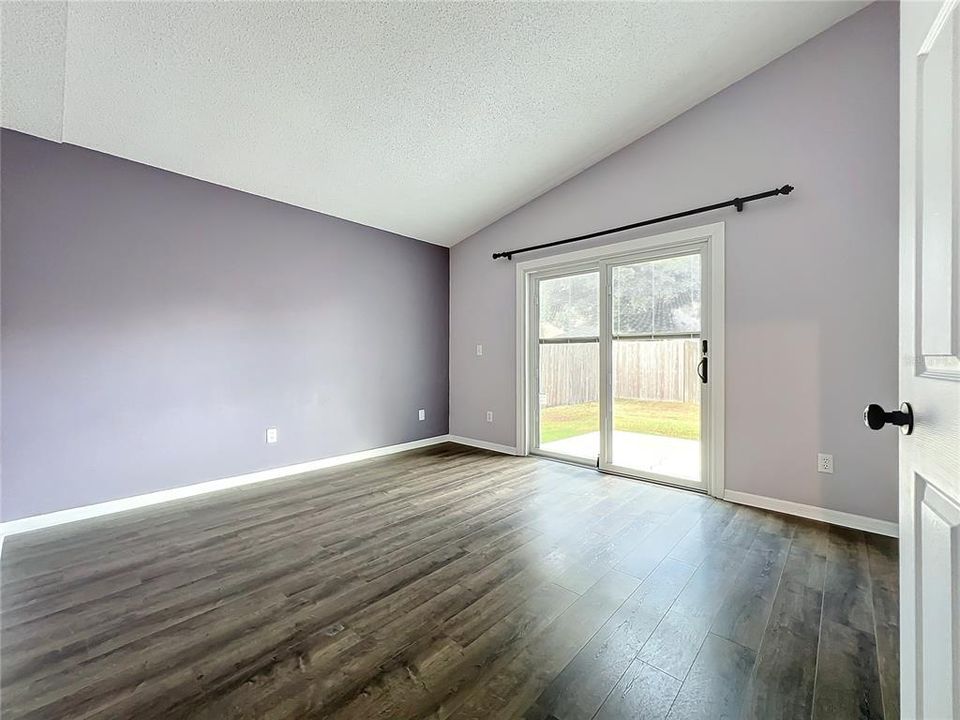 Primary Bedroom with Slider to Fenced Yard