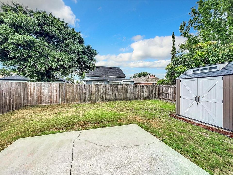 Fully Fenced Backyard with Added Storage Shed