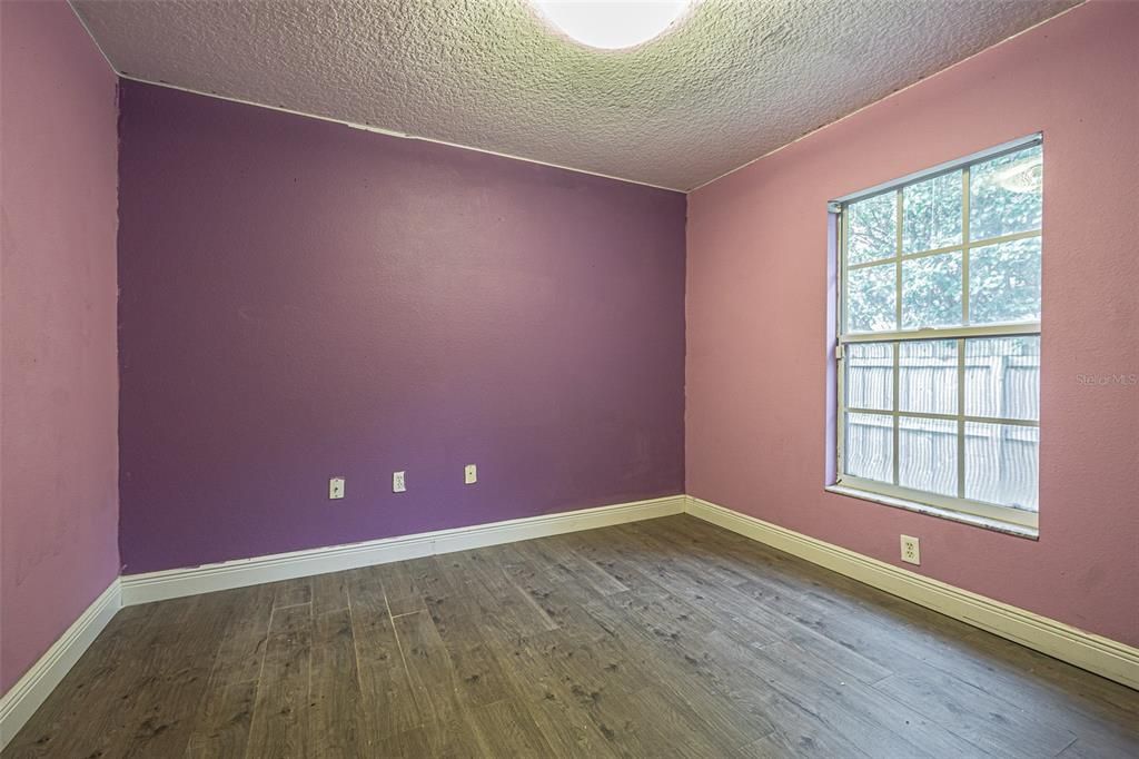 Bedroom 3 overlooks side yard