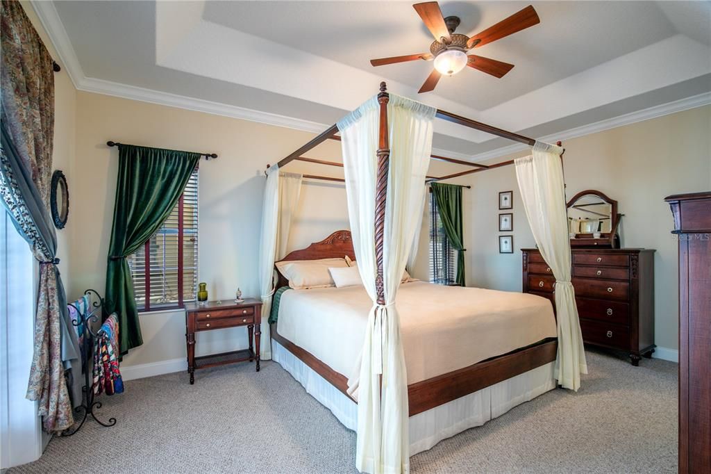 Primary suite is large and has direct access to patio and pool