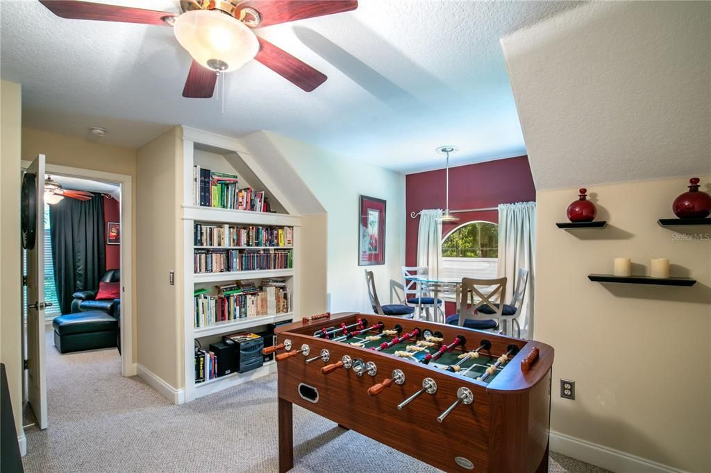 Bonus room upstairs includes a separate bedroom, living area, and bathroom