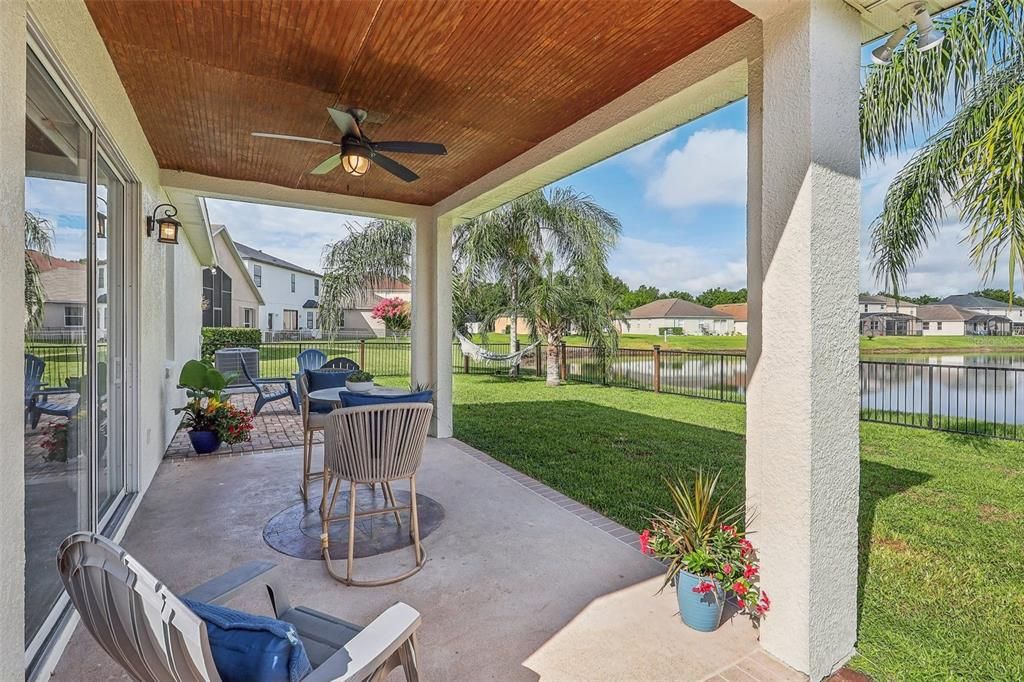 The kitchen is open to a comfortable family room with sight lines straight through to the sweeping WATER VIEWS beyond the covered lanai!