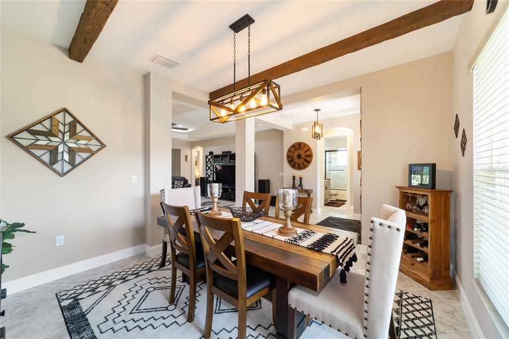 Dining room with beam ceiling