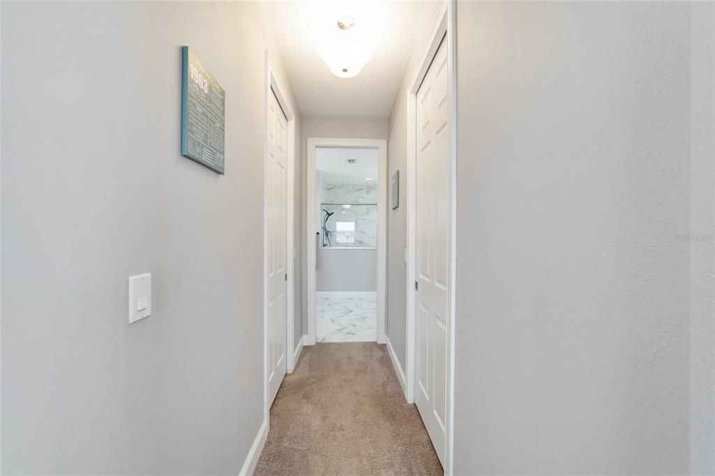 closets on each side leading to bathroom