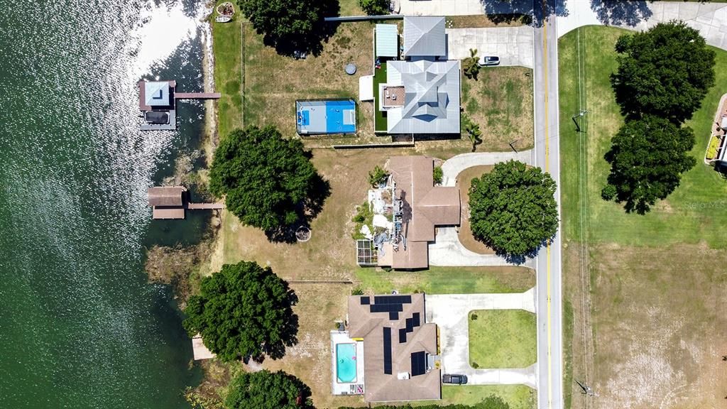 Aeriel view of 1/2 acre waterfront lot with current structure