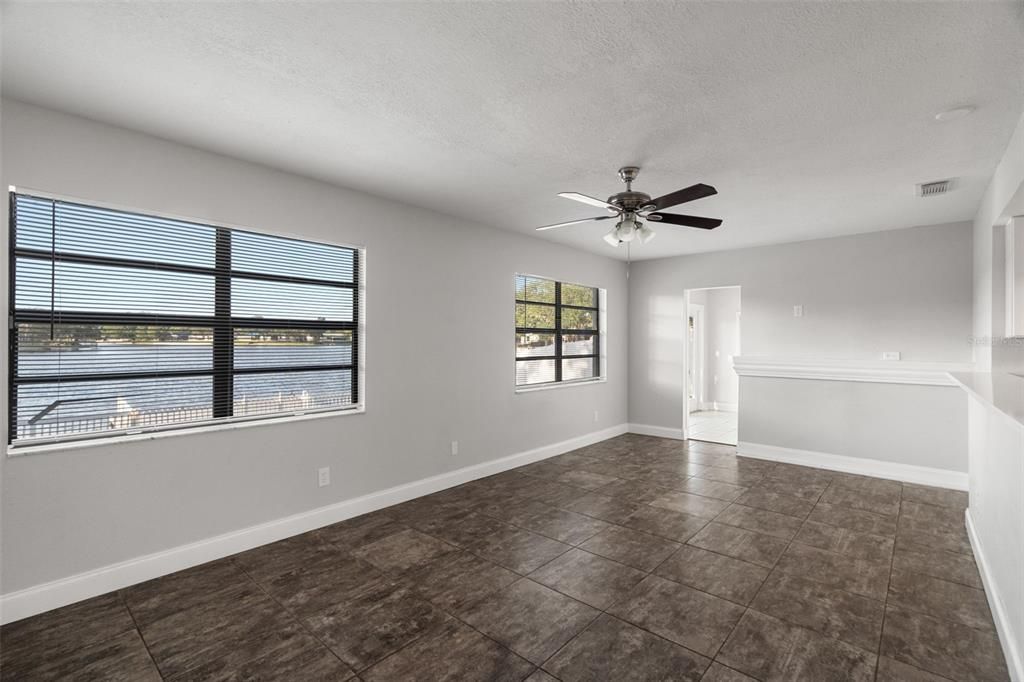 Family room off kitchen that leads into the bonus room with french doors to the pool