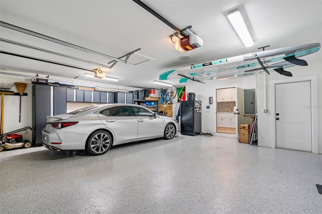 Oversized 2 car garage with epoxy floors and storage