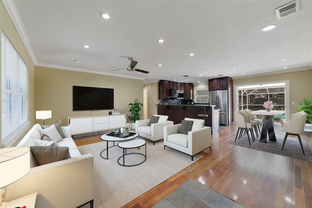 The new owner will enjoy the OPEN CONCEPT main living area featuring WOOD FLOORS, crown molding, recessed lighting and French doors that open up to the screened lanai and pool for indoor/outdoor living and entertaining with ease. Virtually Staged.