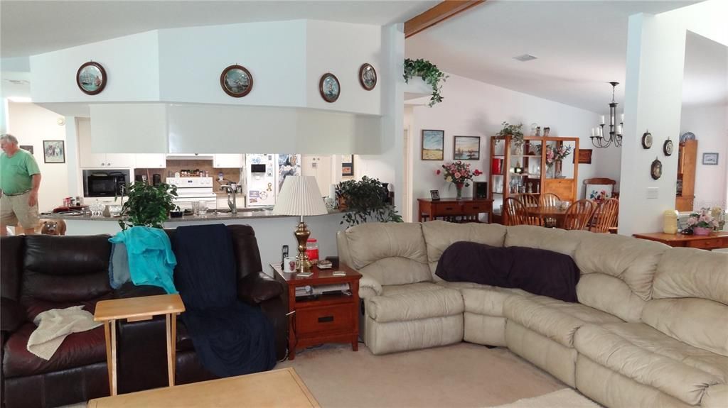 Living room towards kitchen and dining room