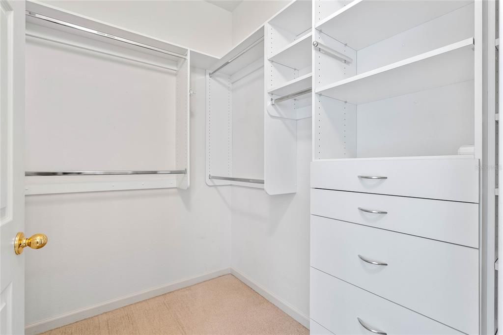 Primary Bedroom walk-in closet w/ organizer