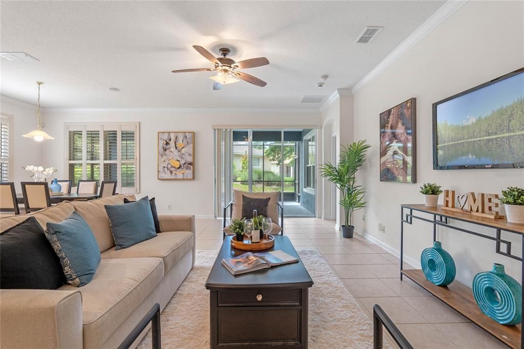 View of the Great Room w/ triple sliding glass doors to the 24' x 16' screen enclosed covered patio