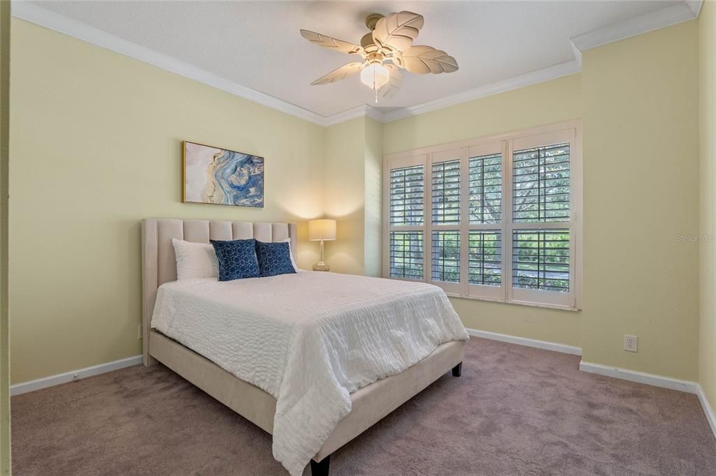 12' 6" x 12' Bedroom #3 w/ crown molding, ceiling fan & Plantation style shutters