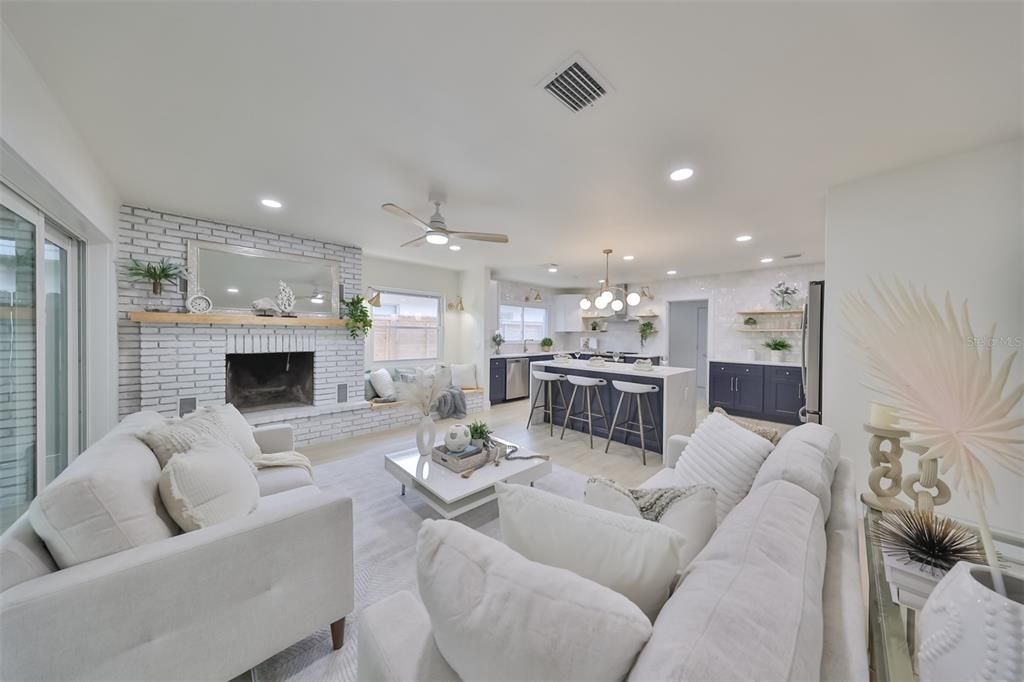 View from the great room to the grand kitchen in shades of  "blueberry" and white