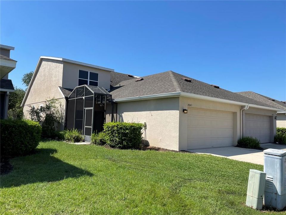 Side of House with Screened in Patio