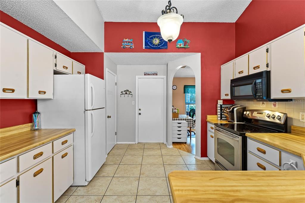 Kitchen towards garage door and dining room