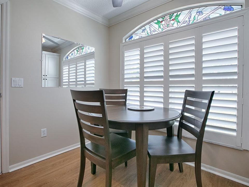 JUST LOOK AT THAT BEAUTIFUL STAINED-GLASS ACCENT DETAIL OVER THE SHUTTERS!!!