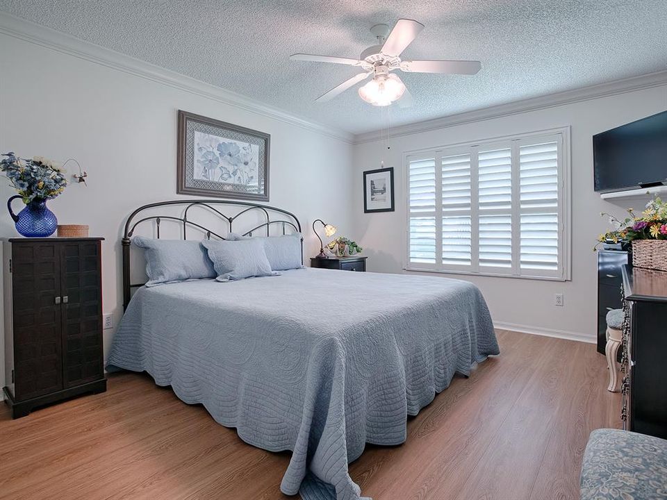 ADDITIONAL GUEST BEDROOM HAS MORE GORGEOUS FLOORING AND PLENTY OF NATURAL LIGHT