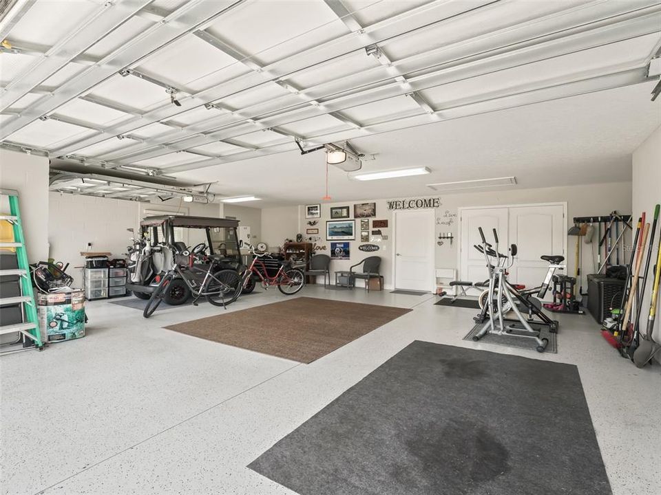 Talk about a spacious garage!  This garage currently houses 2 cars, (SUV and Mini) plus 2 Golf carts and still has room for a small make shift gym!