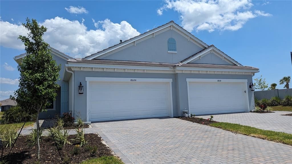 18026 Topiary Park Place; left side unit.