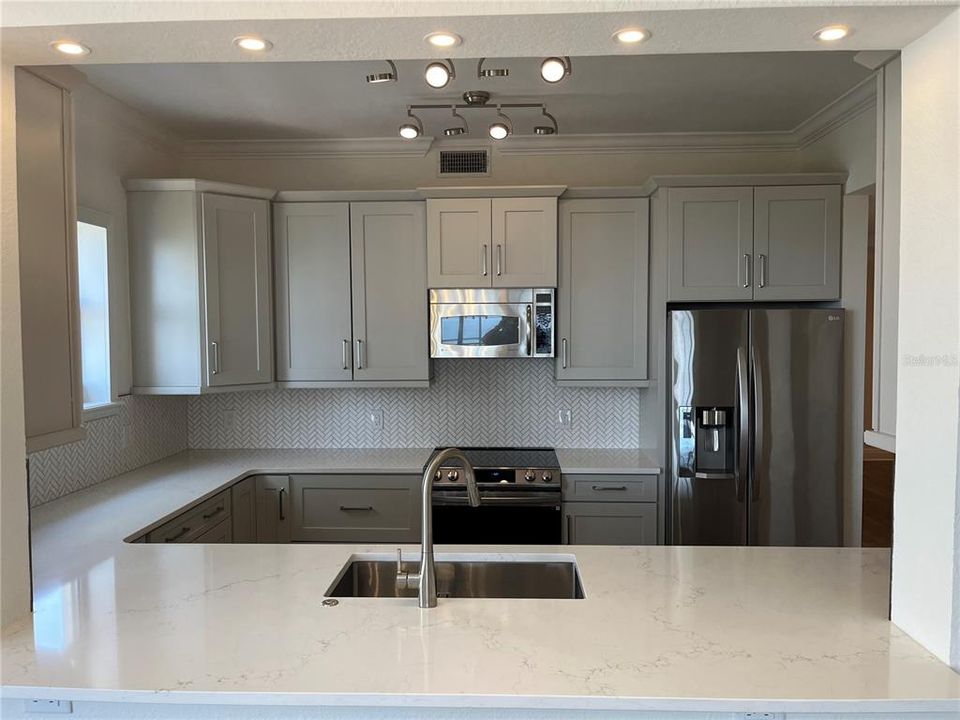 Standing in dining area looking into the kitchen