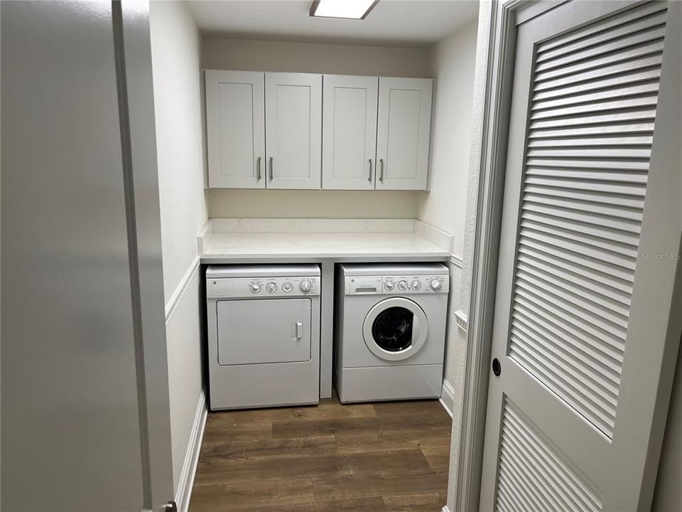 Laundry room with built in ironing board