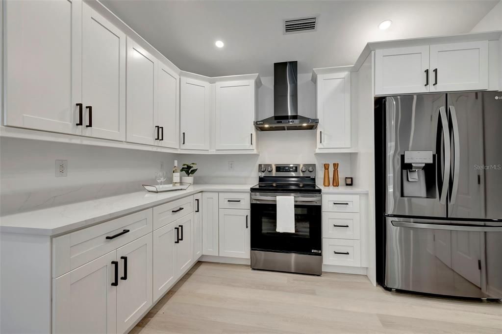 All new stainless steel appliances, cabinets & quartz countertops