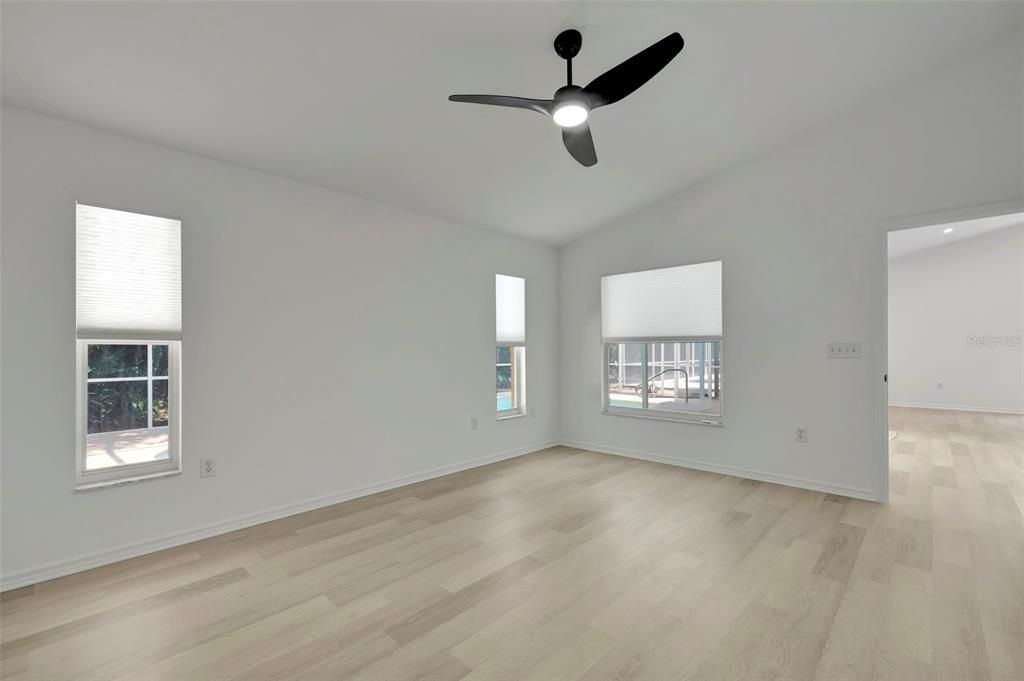 Primary Bedroom facing the pool and nature reserve in backyard