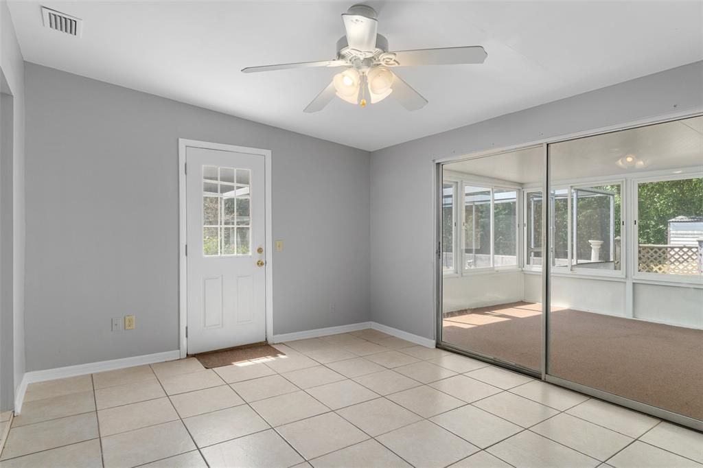 Bonus Room looking into the Enclosed Lanai. The Door leads out to the Sparkling Pool