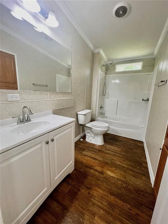This 2nd bathroom is huge and comes complete with built in wall storage closet.