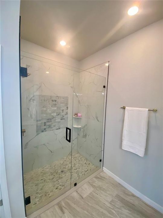 primary bath, walk-in tiled shower with glass door