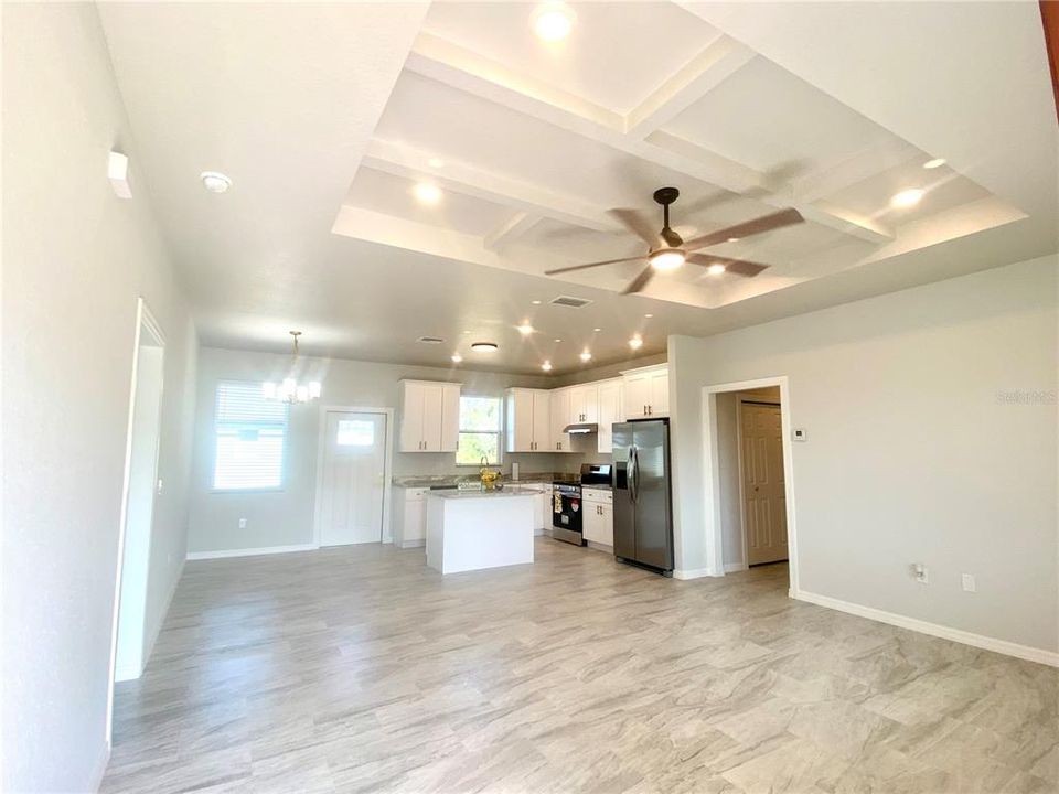 Great room to kitchen, coffered ceiling