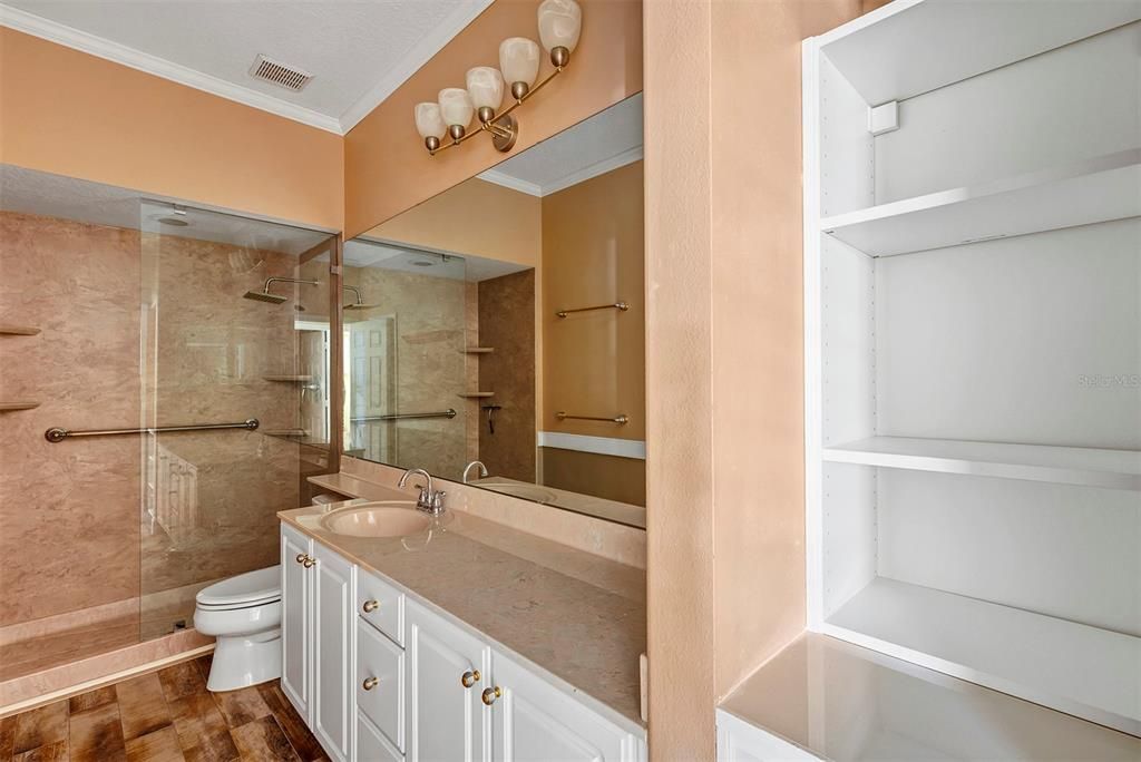 One of two bathrooms with stone counter tops