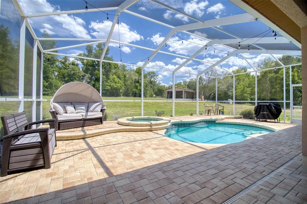 Paver patio around the pool